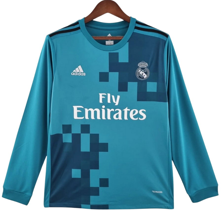 Camiseta retro del Real Madrid temporada 2017-18 tercera equipación de manga larga en color azul petróleo, vista frontal